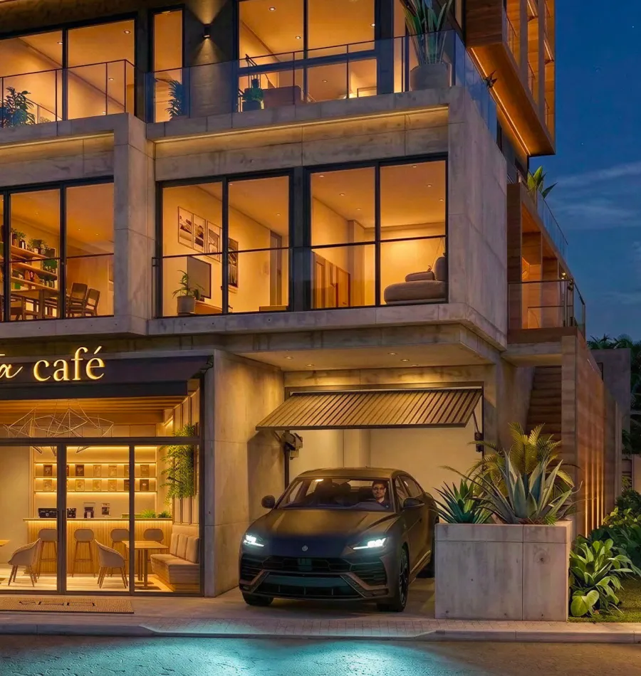 Fachada do Vista à noite, com o Vista café iluminado no térreo